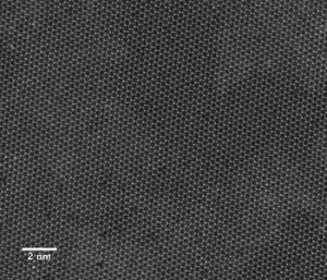 This image from a scanning transmission electron microscope shows the individual atoms in a two-dimensional sheet of molybdenum diselenide. Source: E. Ringe/Rice University..