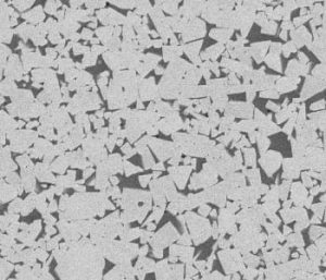 In this SEM image a sol-gel derived composite presenting WC grains (grey phase) embedded in a Fe binder matrix (dark phase) heat treated for 2 h is shown.