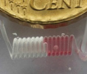A spiral 3D multilayer PDMS microfluidic device, fabricated using the ABS-scaffold-removal method.