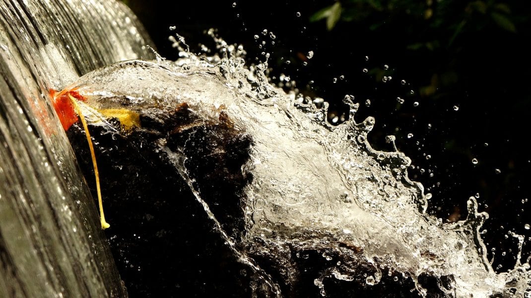 Navigating Turbulent Water: Microboats on a Waterfall