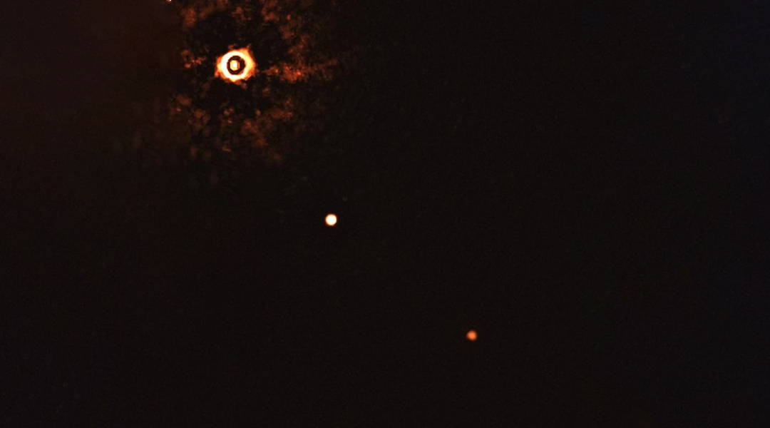 First images of a multi-planet system with a Sun-like star