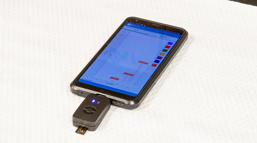 Hand-held device reads levels of cancer biomarker