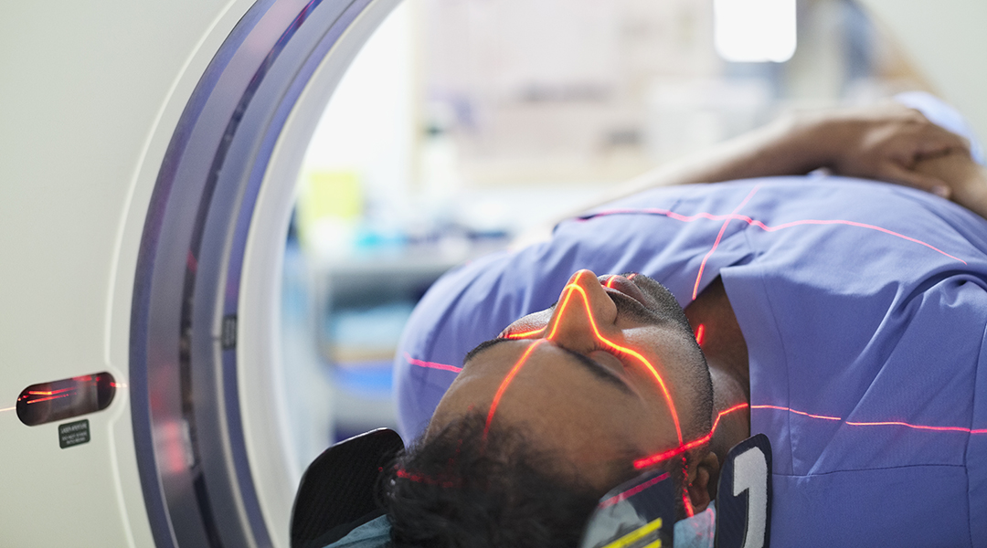 A man lies in a hospital MRI machine