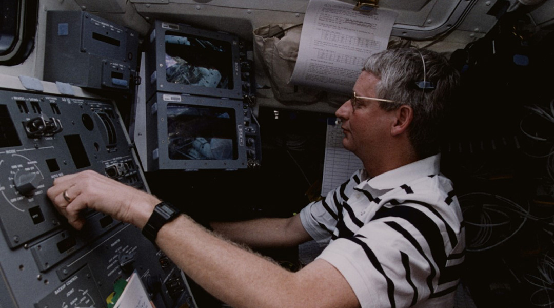 Steven Hawley operating a NASA shuttle