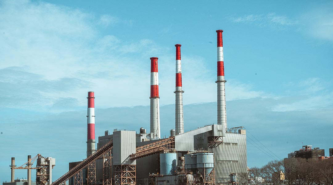 chemical processing plant against a blue sky.