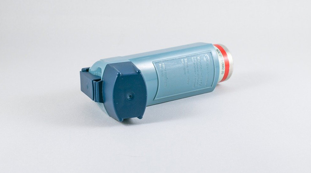 Inhaler for asthma on a white background.