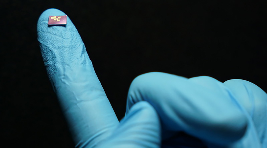 A mini spectrometer, finger for scale.