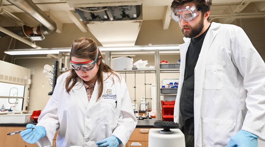 Meredith Barbee in the lab with her student.