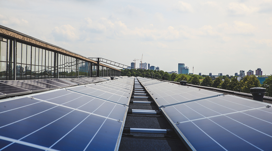 Solar cells against a city background.