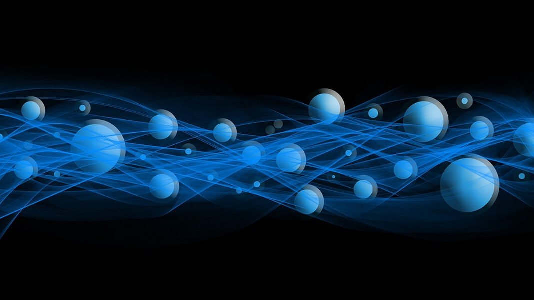 Abstract image of particles on a black background.