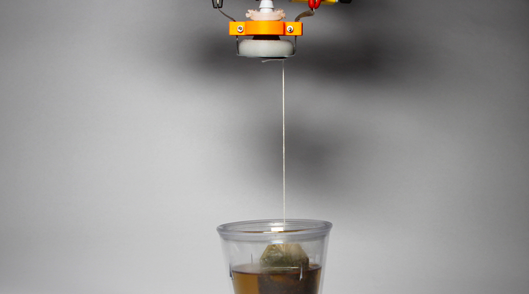 Robot gripper making tea.