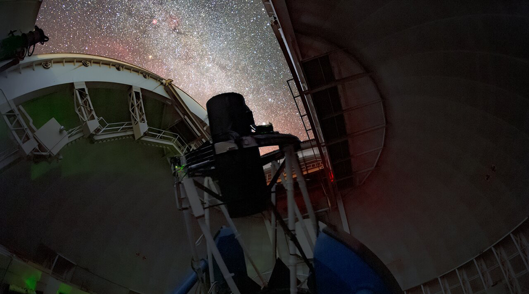 DESI dark energy telescope against a night sky.