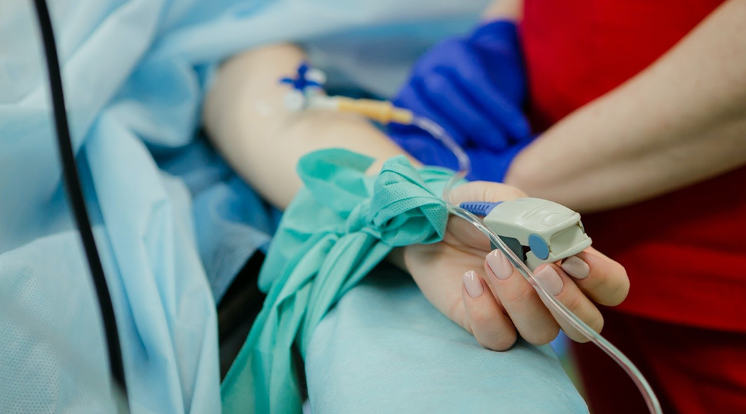 A patient receives chemotherapy through IV.
