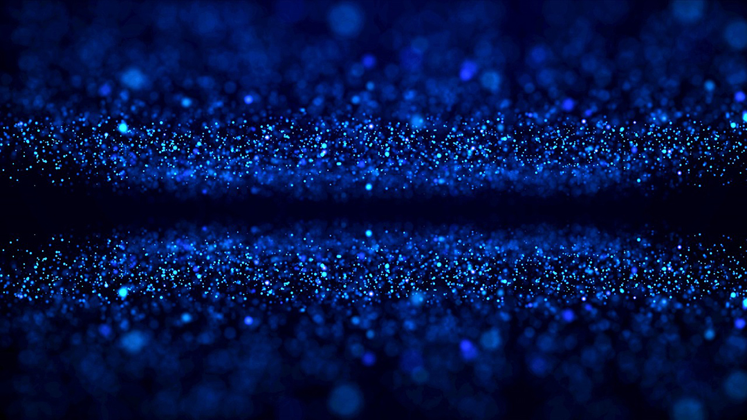 Abstract image of blue particles on a black background.