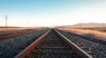 Picture of a rail line moving into the horizon.
