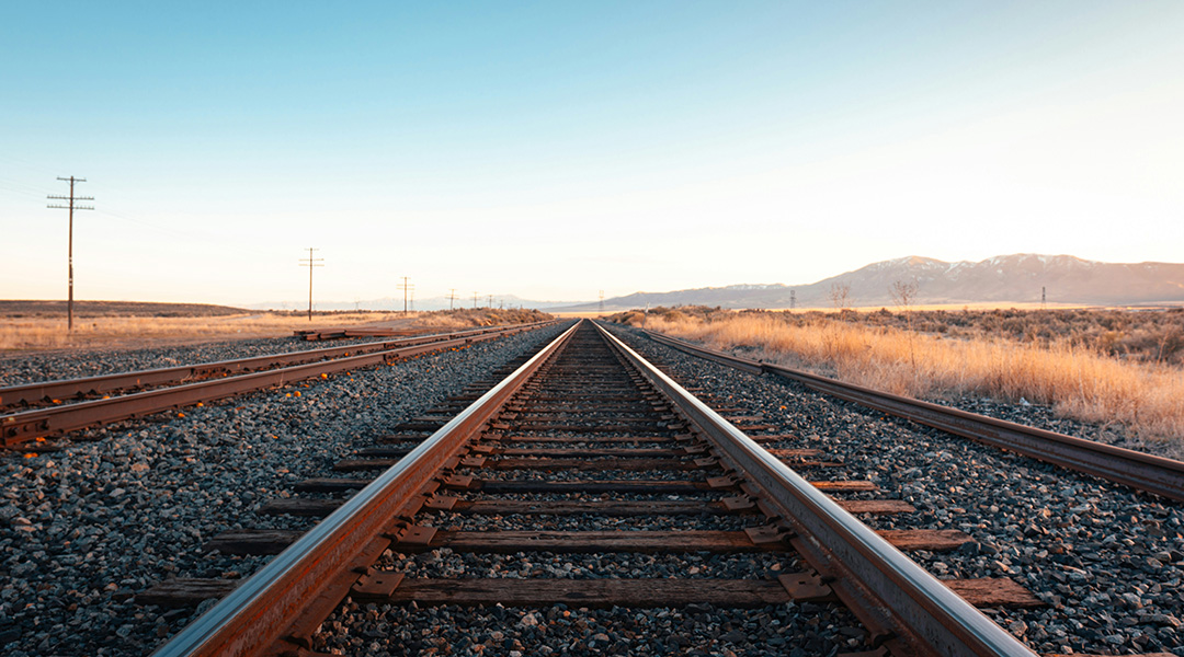 Picture of a rail line moving into the horizon.