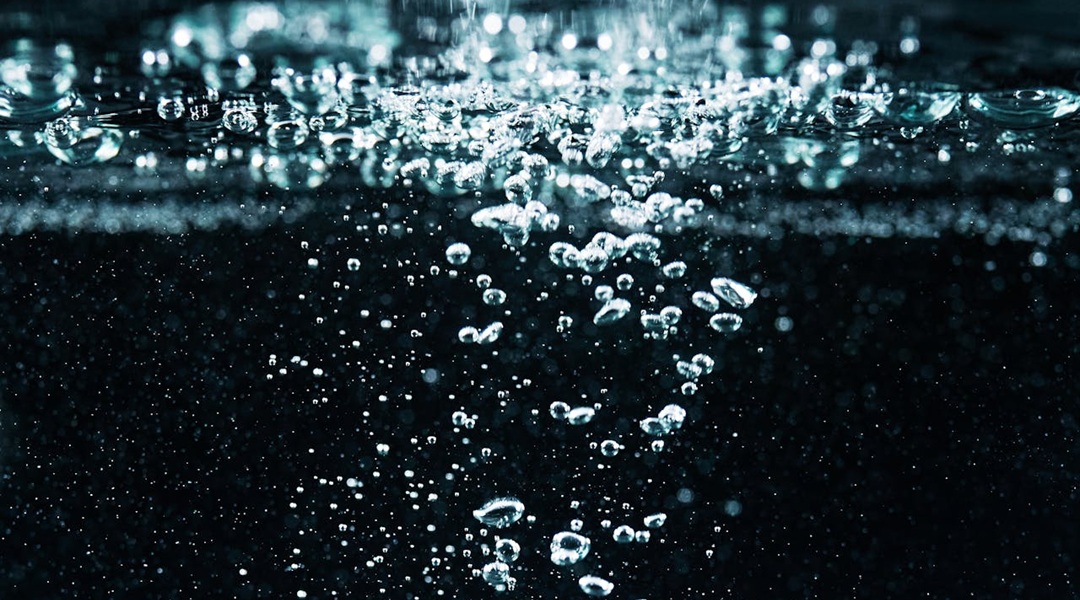 Dark background with microphotography of water bubbles