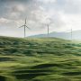 Wind turbines in a green field.