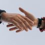 Two hands reaching out to one another